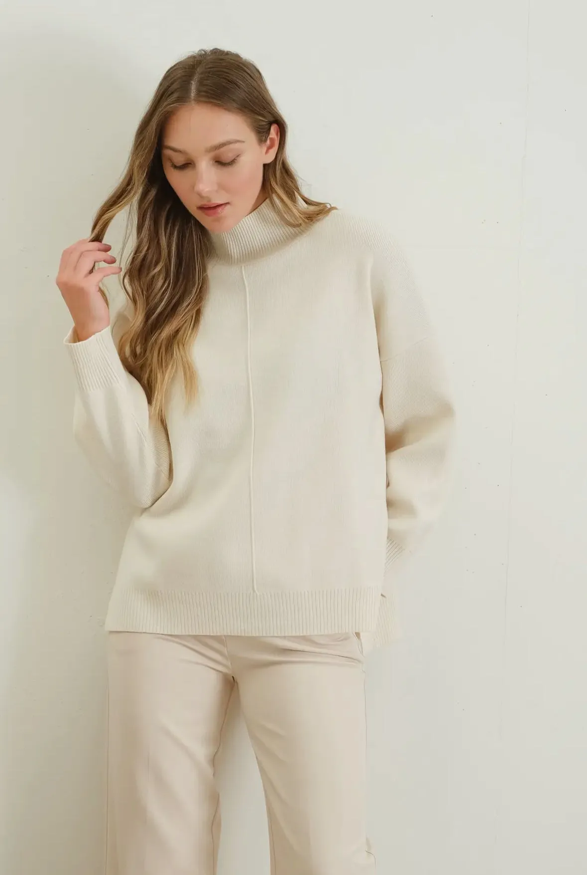 Mock neck front seam pullover sweater